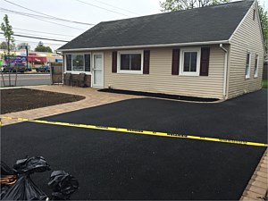 asphalt blacktop driveway plainview with golden brown flush walkway ranch stasi